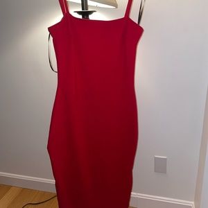Tight red dress with zipper in the back. Very flattering to curves. Worn once.